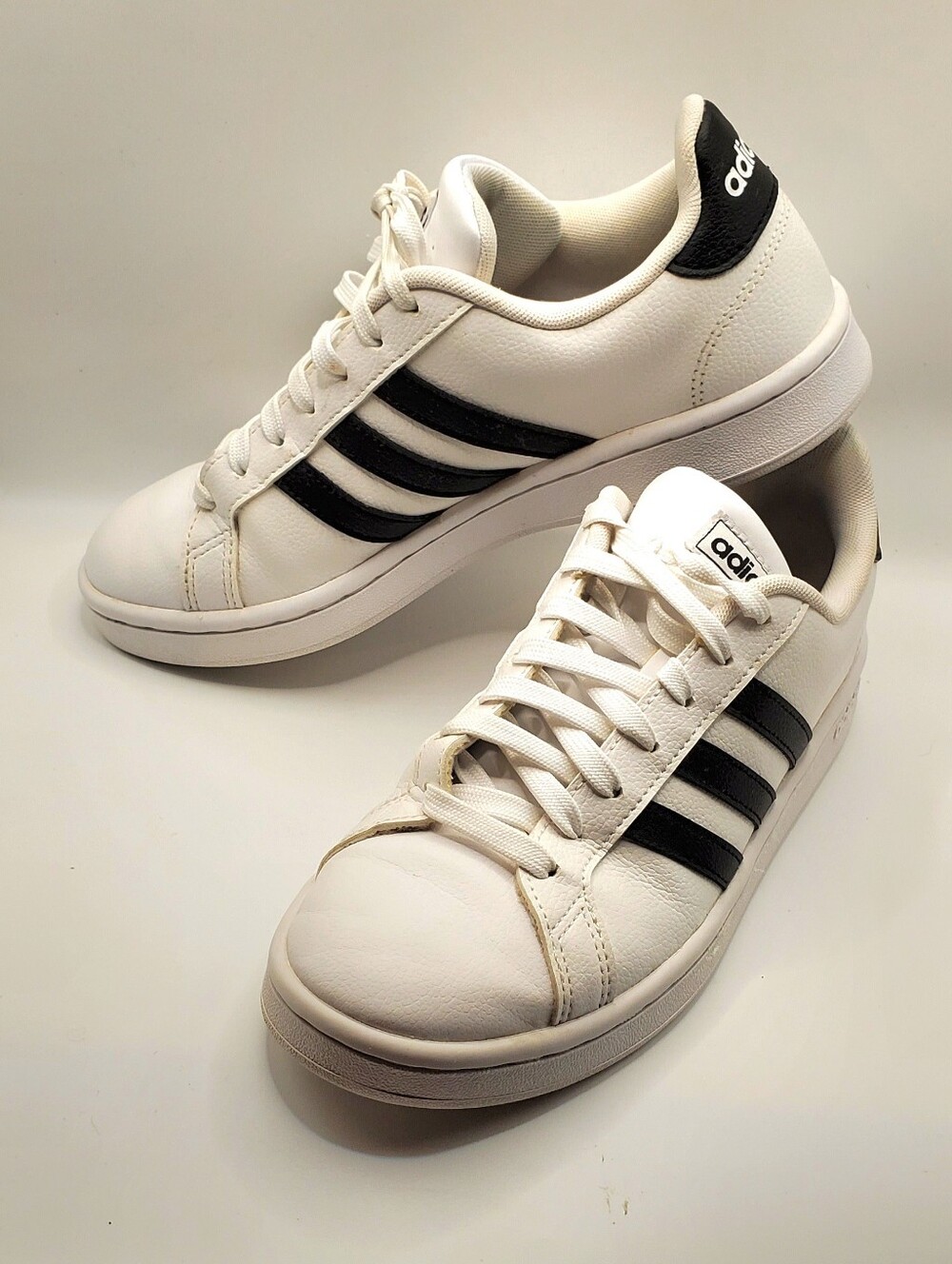 Adidas Women Grand Court Size 7.  White Sneakers with Black Stripes